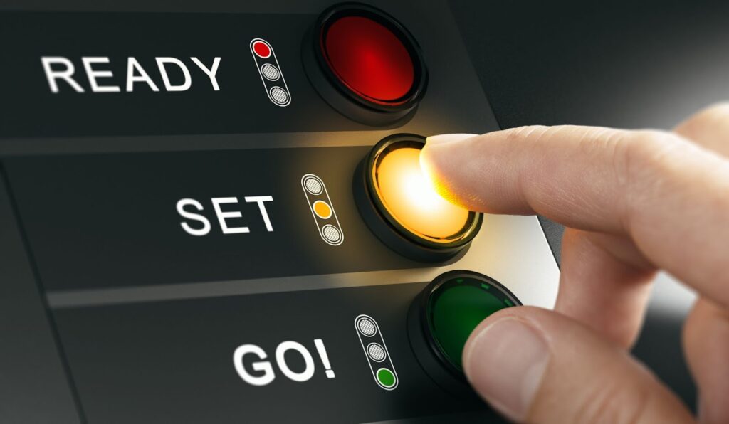 a finger pressing the set button
